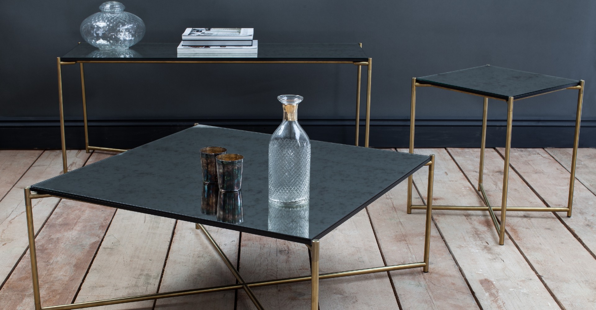Iris Antique Glass tables And Brushed Brass Tables by Gillmore © GillmoreSPACE Ltd
