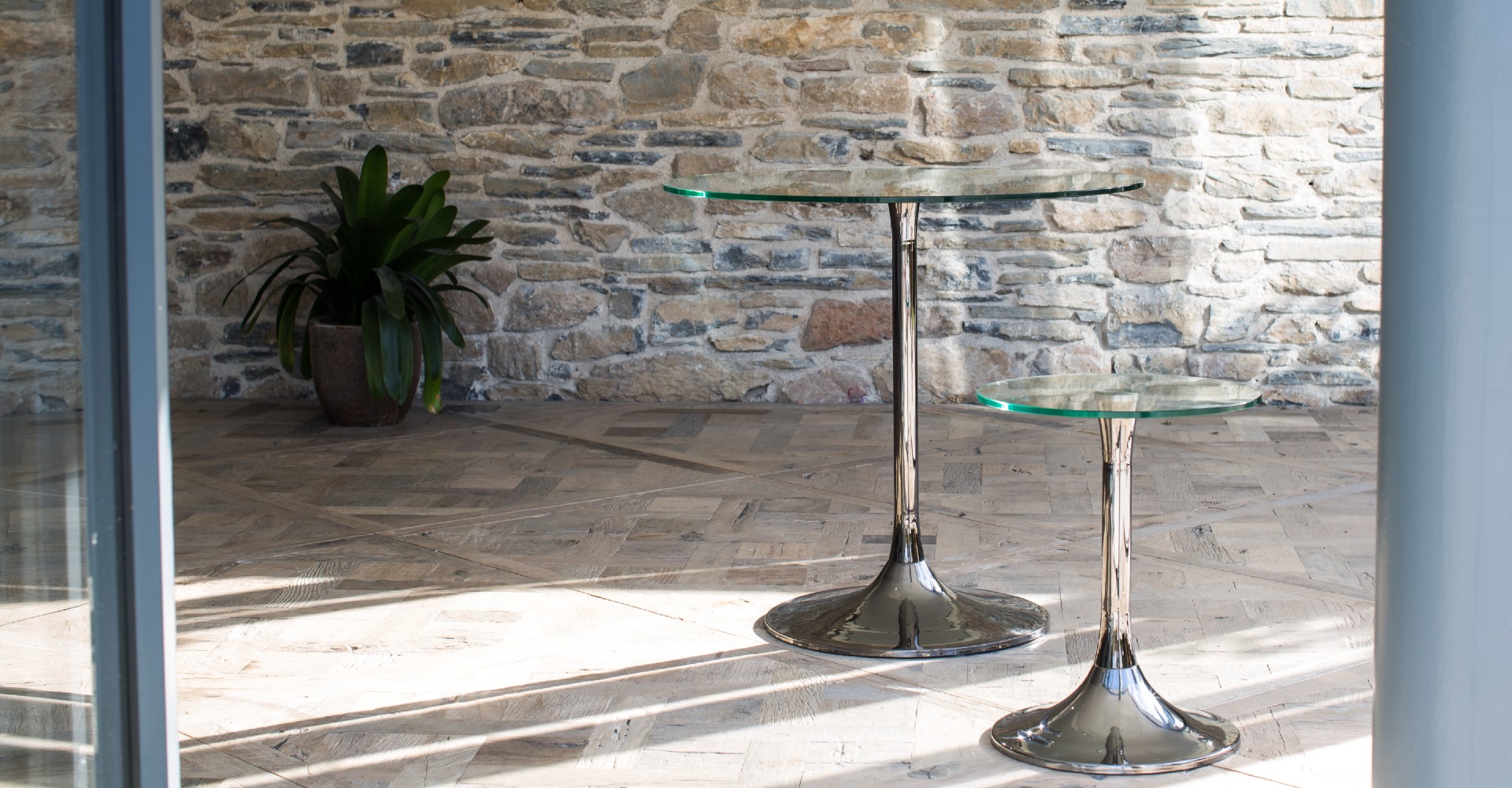 Swan Small Dining Table & Side Table With Clear Glass Tops & Black Chrome Pedestals © GillmoreSPACE Ltd