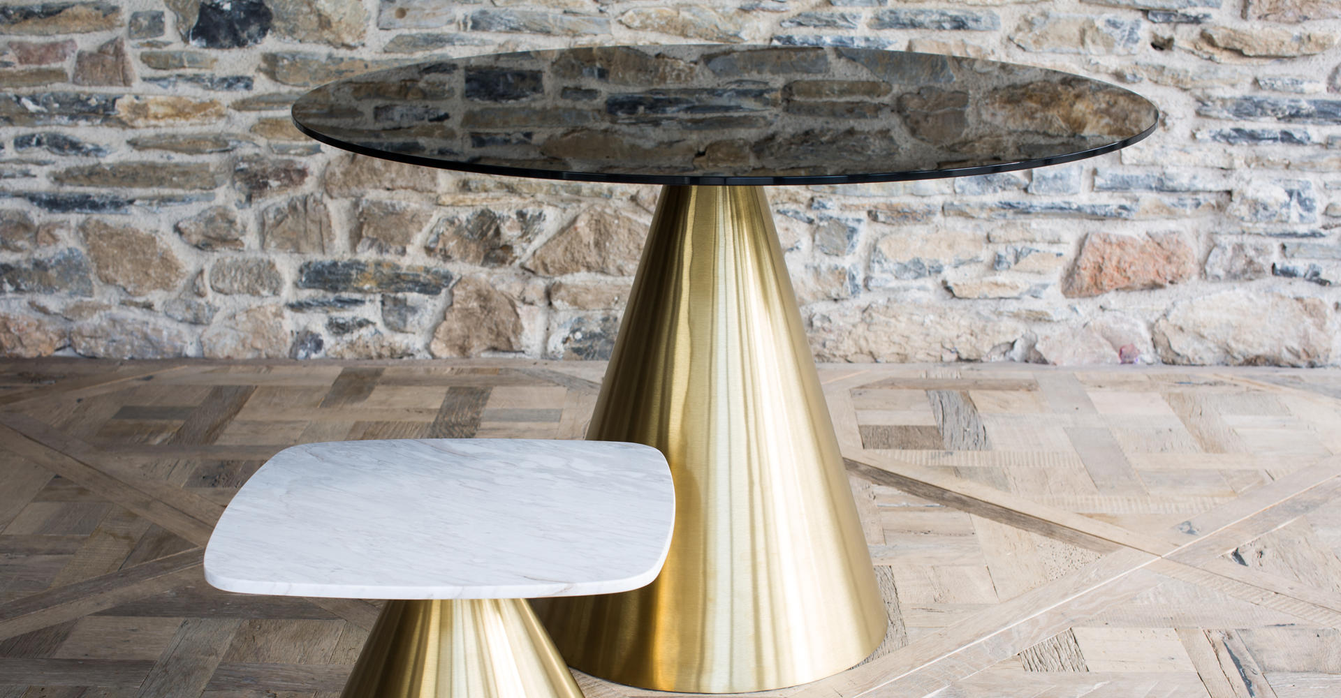 Oscar Black Glass Round Dining Table & Square White Marble Side Table With Brass Pedestals © GillmoreSPACE Ltd
